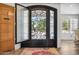 Close-up view of an ornate black wrought iron entry door at 715 S Cactus Wren St, Gilbert, AZ 85296