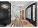 Elegant entryway with black barn door and ornate front door at 715 S Cactus Wren St, Gilbert, AZ 85296