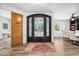 Elegant entryway with a black wrought iron door and decorative rug at 715 S Cactus Wren St, Gilbert, AZ 85296