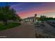 House exterior view at dusk, showcasing a circular driveway and landscaping at 715 S Cactus Wren St, Gilbert, AZ 85296