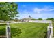 Large grassy front yard with a modern house and a fence at 715 S Cactus Wren St, Gilbert, AZ 85296