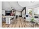 Open kitchen with white cabinets and island, overlooking living room at 715 S Cactus Wren St, Gilbert, AZ 85296