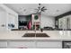 Kitchen island with sink and view of fireplace at 715 S Cactus Wren St, Gilbert, AZ 85296