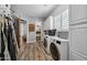 Laundry room with washer, dryer and storage cabinets at 715 S Cactus Wren St, Gilbert, AZ 85296