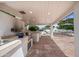 Covered outdoor kitchen with stainless steel appliances at 715 S Cactus Wren St, Gilbert, AZ 85296