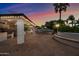 Outdoor kitchen and seating area under a covered patio with string lights at 715 S Cactus Wren St, Gilbert, AZ 85296