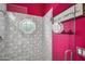 Stylish shower with geometric tile and fuchsia walls at 715 S Cactus Wren St, Gilbert, AZ 85296