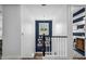 Upstairs hallway with white walls, wood floors, and a chandelier at 715 S Cactus Wren St, Gilbert, AZ 85296