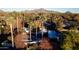 Aerial view of a stunning property with a pool, mountain views, and palm trees at 7249 N Central Ave, Phoenix, AZ 85020