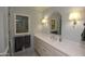 Elegant bathroom with marble vanity, shower, and decorative window at 7249 N Central Ave, Phoenix, AZ 85020