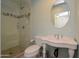 Stylish bathroom with pedestal sink and shower at 7249 N Central Ave, Phoenix, AZ 85020