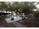 Inviting pool area with mature trees and brick walkways at 7249 N Central Ave, Phoenix, AZ 85020