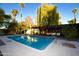 Stunning pool and patio area with a large weeping willow tree at 7249 N Central Ave, Phoenix, AZ 85020