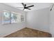 Well-lit bedroom with tile floors and a ceiling fan at 725 S Power Rd # 214, Mesa, AZ 85206