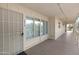 Building hallway with access to unit and large windows at 725 S Power Rd # 214, Mesa, AZ 85206