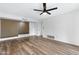 Living room featuring wood-look floors and a ceiling fan at 725 S Power Rd # 214, Mesa, AZ 85206