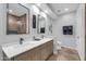 Elegant bathroom with double vanity and walk-in shower at 7272 E Gainey Ranch Rd # 74, Scottsdale, AZ 85258