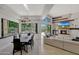 Bright dining area with modern table and chairs, offering a view of the pool at 7347 E Turquoise Ave, Scottsdale, AZ 85258