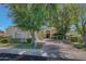 Beautiful home with mature trees and a welcoming front entrance at 7347 E Turquoise Ave, Scottsdale, AZ 85258