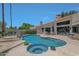 Inviting kidney shaped pool with spa and ample lounge space at 7347 E Turquoise Ave, Scottsdale, AZ 85258