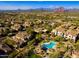 Aerial view of community with pool and mountain backdrop at 7445 E Eagle Crest Dr # 1065, Mesa, AZ 85207