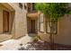 Private courtyard entrance with a walkway and small trees at 7445 E Eagle Crest Dr # 1065, Mesa, AZ 85207