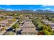 Aerial view of community with pool, mountains in background at 7691 E Fledgling Dr, Scottsdale, AZ 85255