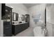 Elegant bathroom with double vanity, soaking tub, and marble floors at 7691 E Fledgling Dr, Scottsdale, AZ 85255