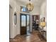 Bright entryway with hardwood floors, a large mirror, and access to an office at 7691 E Fledgling Dr, Scottsdale, AZ 85255