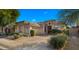 Beautiful single-story home with a well-maintained front yard and landscaping at 7691 E Fledgling Dr, Scottsdale, AZ 85255