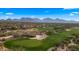 Golf course with desert landscape and distant mountains at 7691 E Fledgling Dr, Scottsdale, AZ 85255