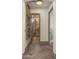 Elegant hallway with hardwood floors and access to a bathroom at 7691 E Fledgling Dr, Scottsdale, AZ 85255