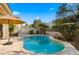 Private kidney-shaped pool and patio at 7691 E Fledgling Dr, Scottsdale, AZ 85255