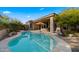 Stunning kidney-shaped pool with ample surrounding space for relaxation at 7691 E Fledgling Dr, Scottsdale, AZ 85255