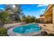 Inviting kidney-shaped pool with surrounding patio at 7691 E Fledgling Dr, Scottsdale, AZ 85255