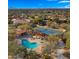 Aerial view of community pool and tennis courts at 7691 E Fledgling Dr, Scottsdale, AZ 85255