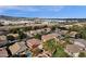 Aerial view of neighborhood homes with pools and landscaping; mountains and industrial area in the distance at 7893 S Stephanie Ln, Tempe, AZ 85284