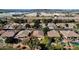 Aerial view of neighborhood homes with pools and landscaping; mountains and industrial area in the distance at 7893 S Stephanie Ln, Tempe, AZ 85284