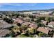 Aerial view of homes in a neighborhood, showcasing pools and landscaping with mountains in the background at 7893 S Stephanie Ln, Tempe, AZ 85284