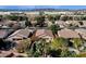 Aerial view of neighborhood homes with pools and landscaping; mountains and industrial area in the distance at 7893 S Stephanie Ln, Tempe, AZ 85284