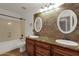 Bathroom with double vanity and stone tile at 7893 S Stephanie Ln, Tempe, AZ 85284