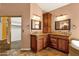 Double vanity bathroom with wood cabinets and granite countertop at 7893 S Stephanie Ln, Tempe, AZ 85284