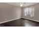 Bedroom with dark hardwood floors and neutral walls at 7893 S Stephanie Ln, Tempe, AZ 85284