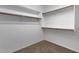 Large walk-in closet with double hanging rods and shelving at 7893 S Stephanie Ln, Tempe, AZ 85284