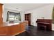 Home office with built-in shelving and dark wood desk at 7893 S Stephanie Ln, Tempe, AZ 85284