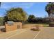 Built-in outdoor kitchen with fire pit at 7893 S Stephanie Ln, Tempe, AZ 85284