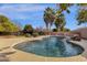 Refreshing kidney-shaped pool with waterfall feature at 7893 S Stephanie Ln, Tempe, AZ 85284