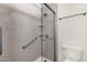 Clean shower with glass enclosure and grab bars at 7893 S Stephanie Ln, Tempe, AZ 85284