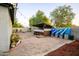 Landscaped backyard with patio, bar, and water tanks at 7917 W Sierra Vista Dr, Glendale, AZ 85303