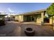 Backyard with patio, firepit and view of house at 7917 W Sierra Vista Dr, Glendale, AZ 85303